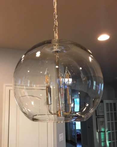 A reviewer's photo of a sparkling clean light fixture