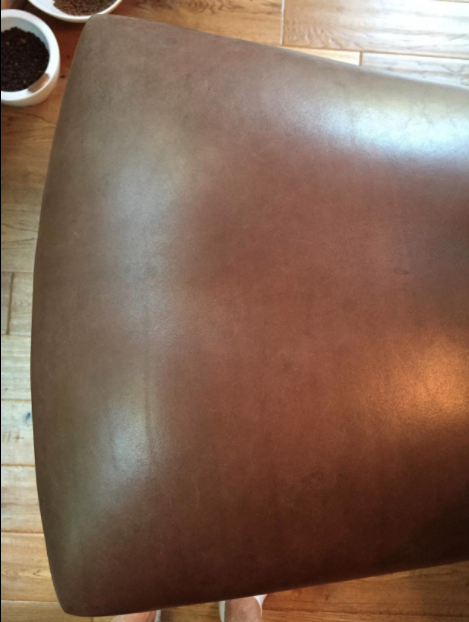 And here’s the after: the same barstool, now free of water stains, looking cleaner with a refreshed, lighter brown shade.