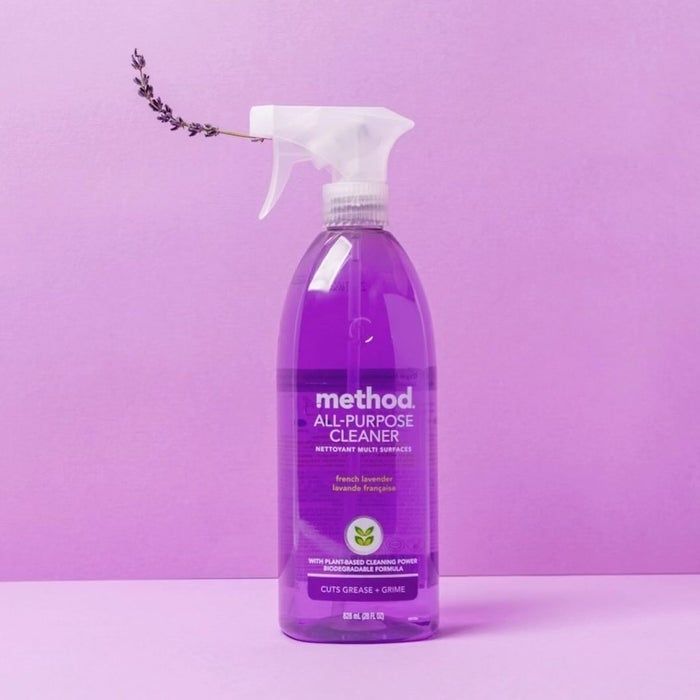 A bottle of Method All-Purpose Cleaner with a French lavender fragrance, set against a neutral background, highlighting its plant-based cleaning properties and its ability to cut through grease.