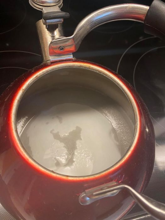 Reviewer photo showing mineral deposits inside a tea kettle