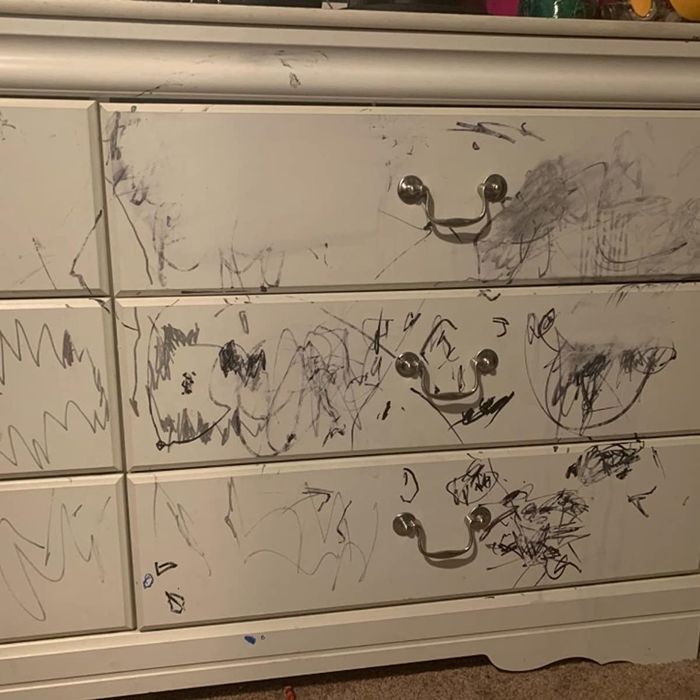 A reviewer shares an image of a white dresser covered in black permanent marker scribbles.