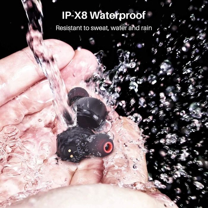 Black earbuds floating in water