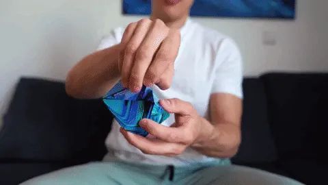 A video showing a model turning the cube into various shapes