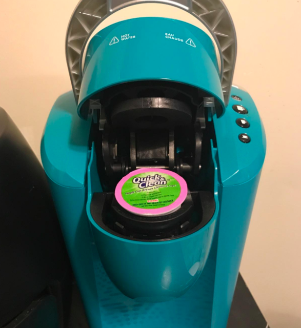 A customer-uploaded photo showcasing their Keurig machine with a cleaning cup inside it