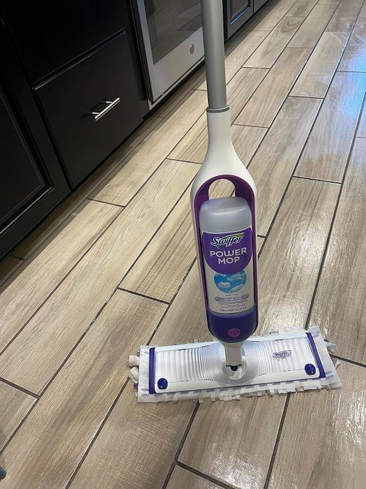 Swiffer Power Mop on a kitchen floor.