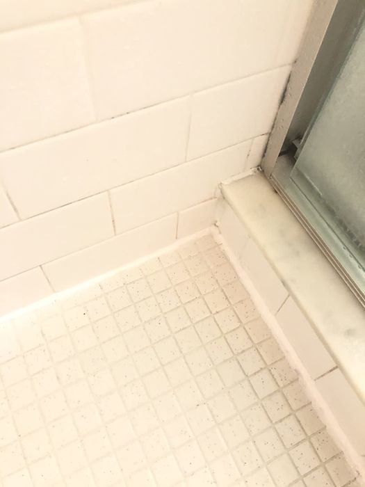 The same bathroom with the mold completely removed from the sealant.