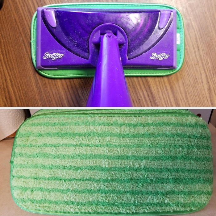 A Swiffer mop equipped with a dry sweeping cloth, viewed from above, ready for floor cleaning