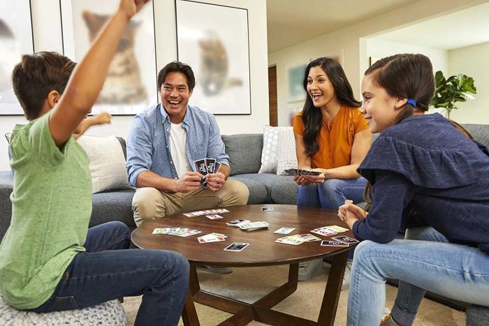 A family enjoying a game of cards together.