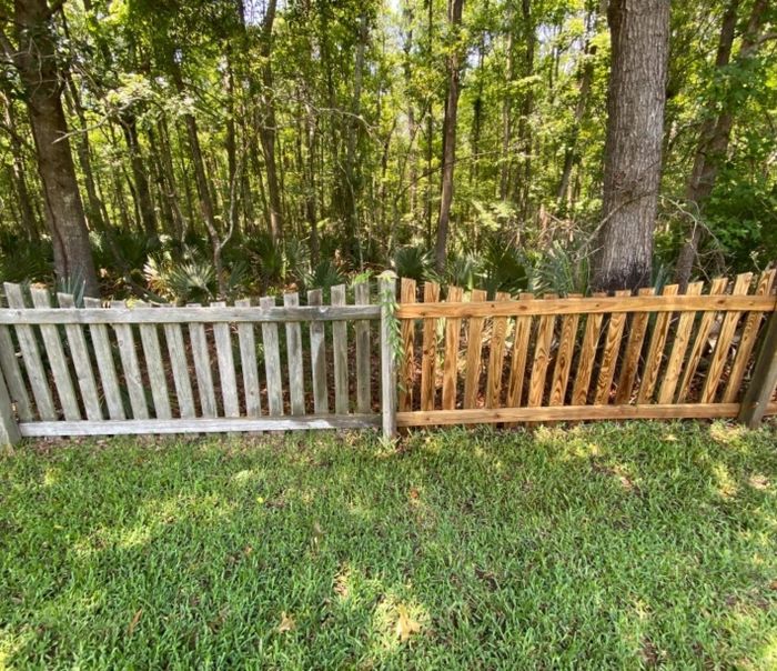 The review describes a wooden fence where one side remains dirty while the other side has been cleaned using a pressure washer.