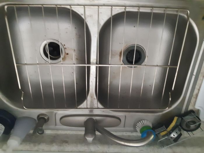 A reviewer's photo showing the same oven rack after being cleaned with Green Miracle Cleaner.
