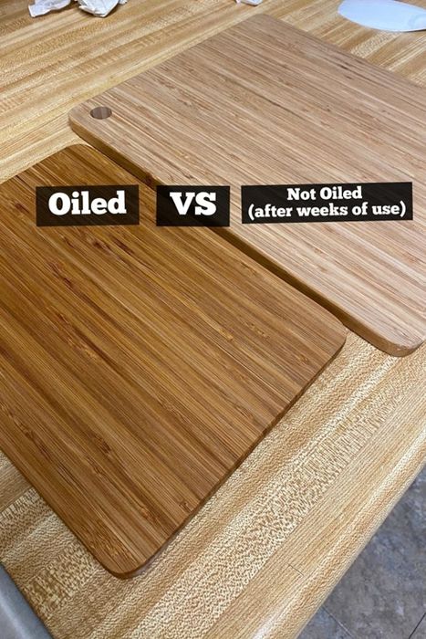 A comparison of two identical cutting boards placed side by side: one has been oiled, giving it a dark, glossy finish, while the other remains untreated and pale.