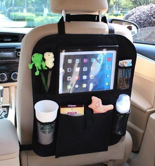 A close-up of the organizer holding a coffee cup, iPad, and toys
