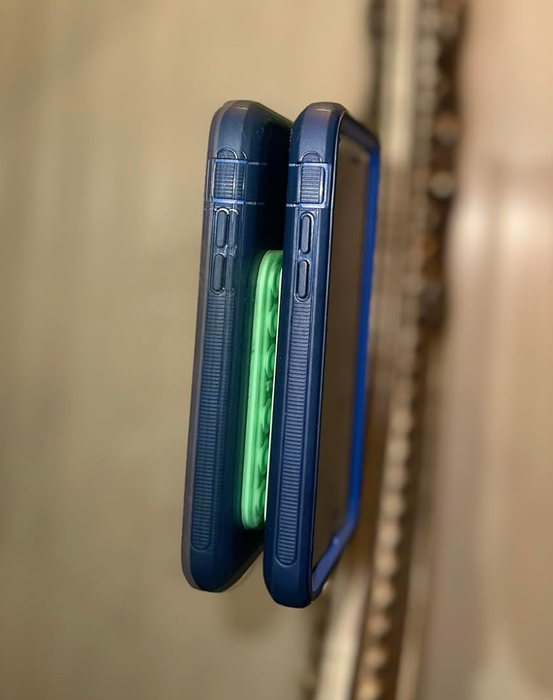 Two smartphones with protective cases, shown from the side, highlighting their thickness and button placements.