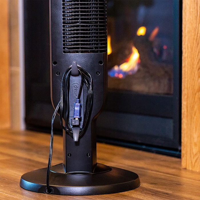 The adhesive affixed to a fan, with the cord wrapped around it.