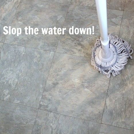 Mop on the floor with the caption 'slop the water down!'