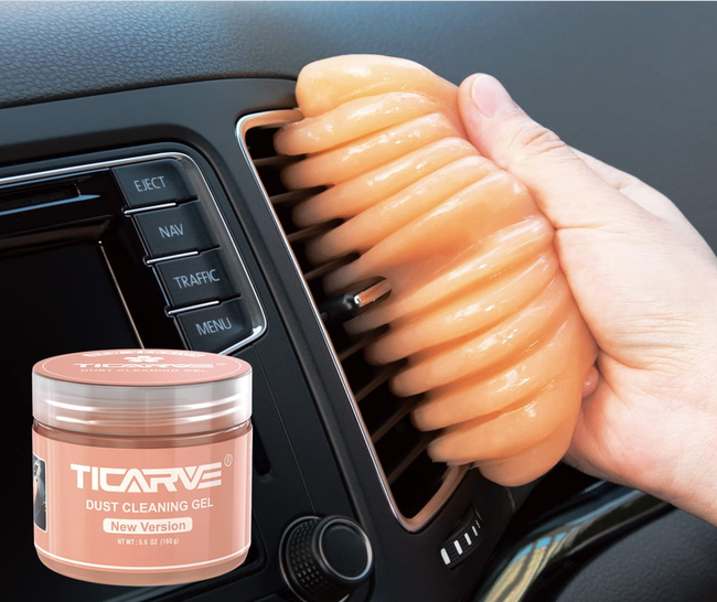A model using putty to clean the air vent of a car