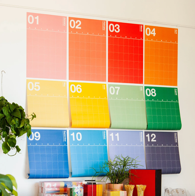 A colorful 12-month wall calendar.