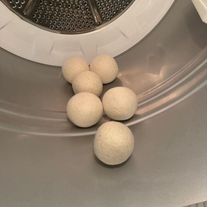 Wool dryer balls inside a clothes dryer, ready to do their job.