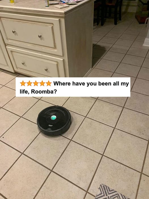 A reviewer’s Roomba, receiving five-star praise and an enthusiastic review text.