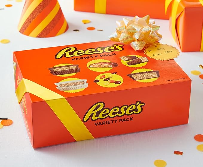 A variety pack box of Reese's candies, tied with a bow.