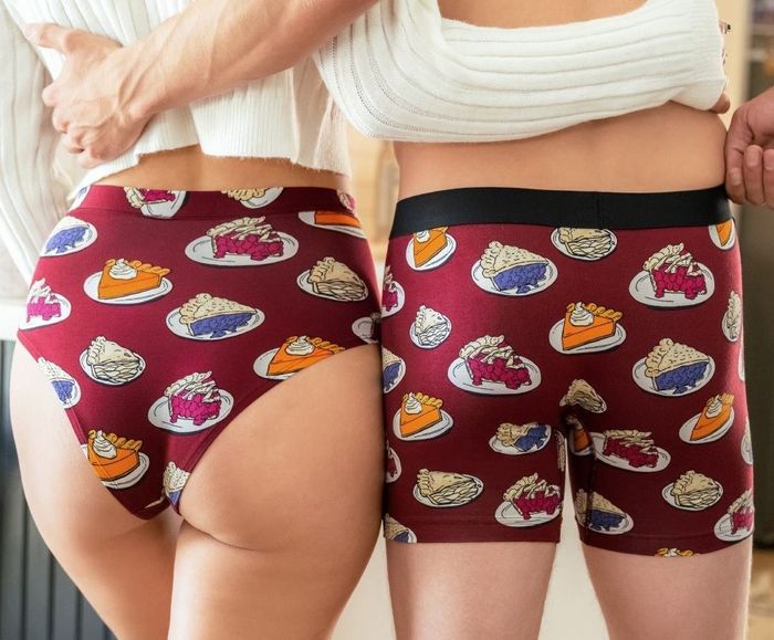 Two models sporting matching underwear featuring a playful pie print.