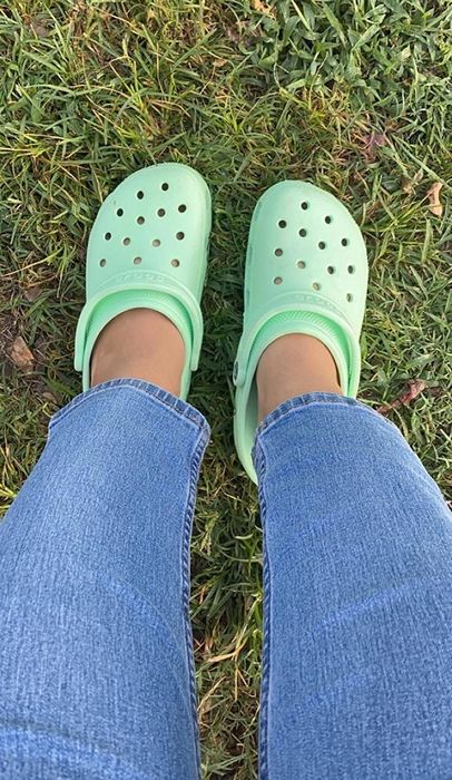 Another reviewer rocking seafoam green Crocs for a chill, easygoing look.