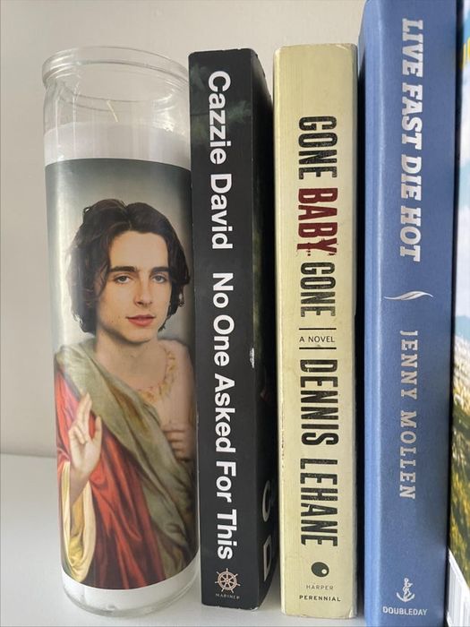 A candle featuring Timothée Chalamet as a saint.