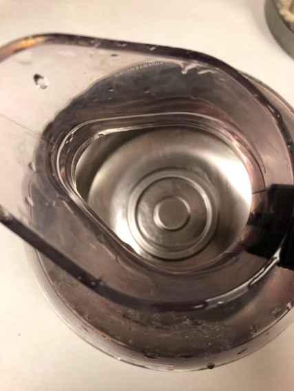 After: The same pot, now gleaming and spotless with no remaining residue.