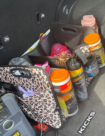 The organizer filled with water bottles, supplies, and snacks, keeping everything organized and within reach.