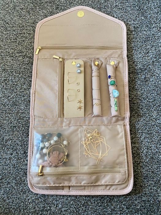 Reviewer photo showing the jewelry organizer filled with various pieces of jewelry.