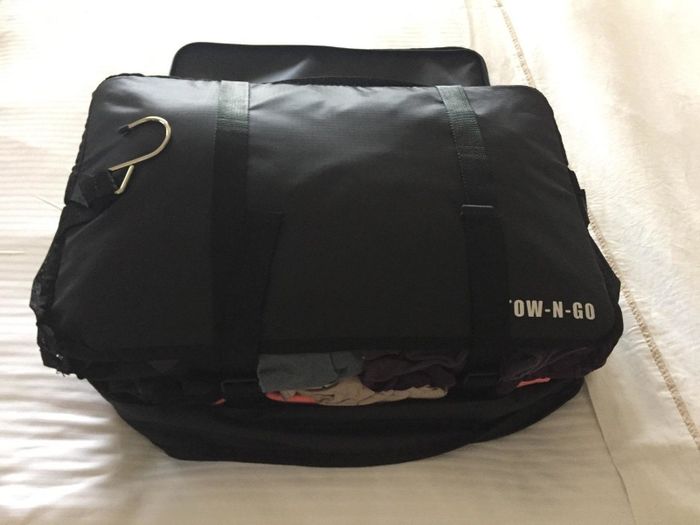 a review image showing a packing cube filled with clothes