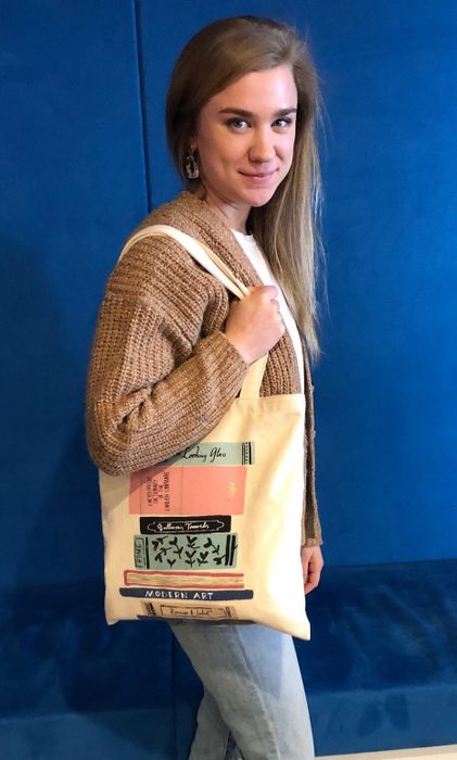 Mytour writer modeling the book tote