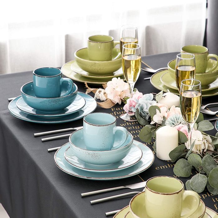 A table set with blue and green dinnerware, elegantly arranged.