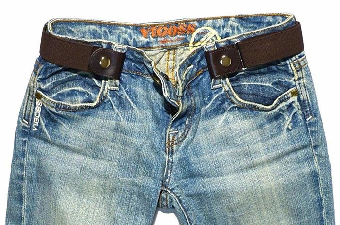 A brown snap-on belt attached to a pair of pants