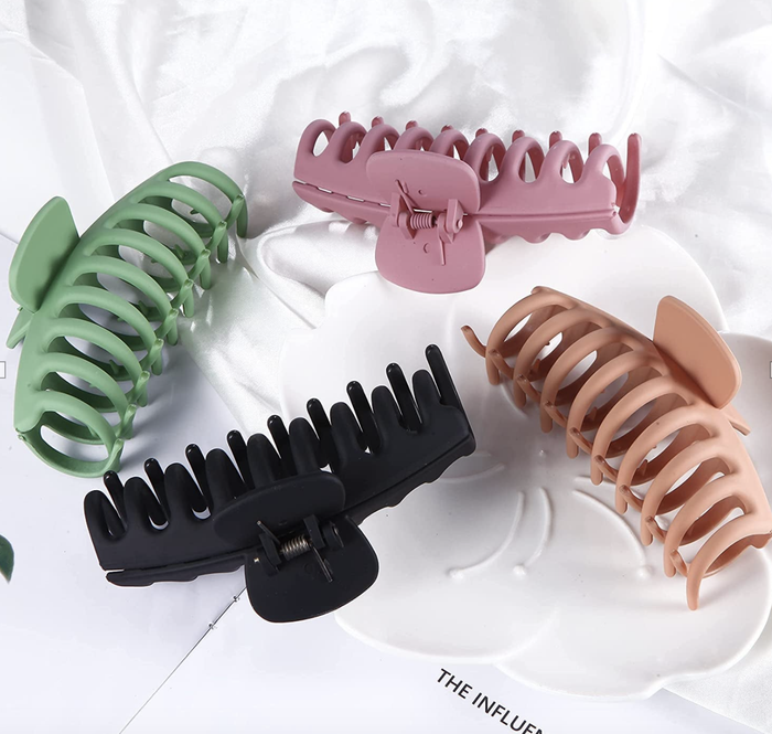 Claw clips available in green, black, beige, and pink colors
