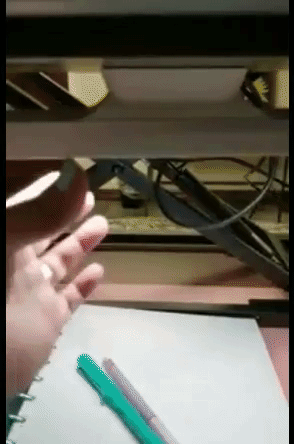 A reviewer detaching the light from its base to use as a flashlight.