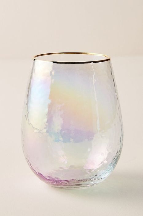 A beautifully textured glass with a gold rim and a dazzling iridescent finish.