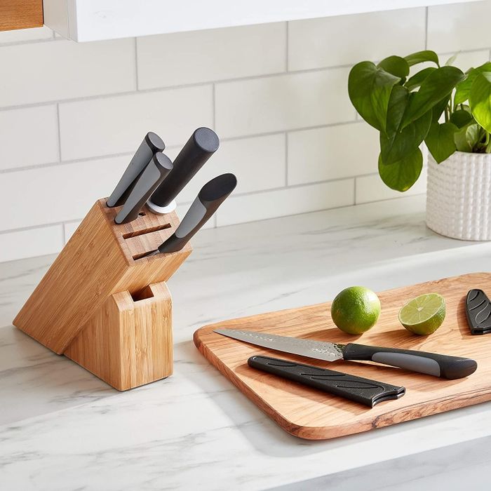 The elegant knives with black handles.