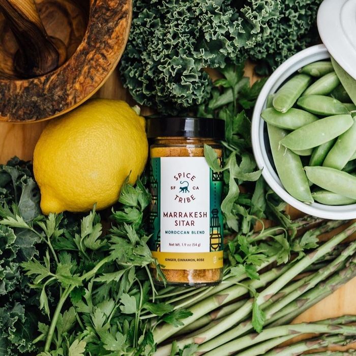 The Marrakesh Sitar spice jar nestled in a bed of greens.
