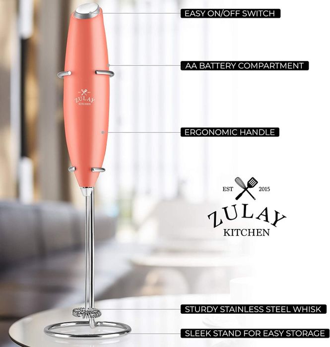 the frother in a lovely pink color, with labels explaining the function of each part of the device