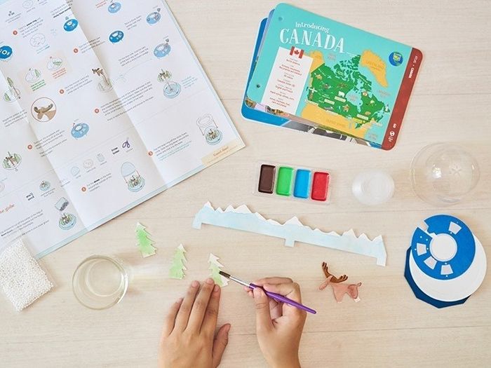 A person creating artwork as part of a project focused on Canada.