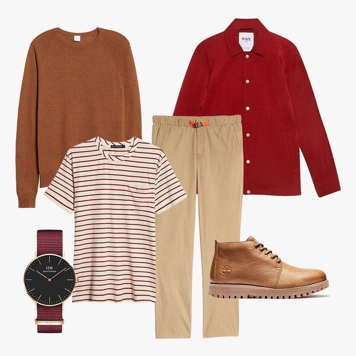 A variety of men's apparel including pants, a comfortable tee, a warm sweater, a sharp button-up shirt, a sophisticated watch, and sturdy boots.
