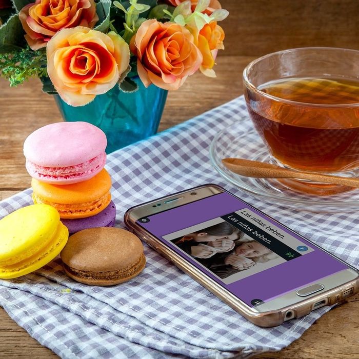 A phone displaying a Rosetta Stone language lesson.