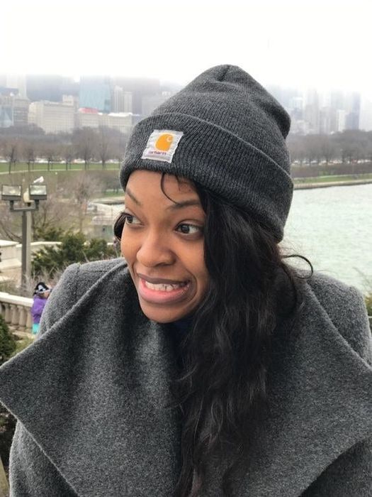 The reviewer in a great knit beanie featuring the Carhartt logo on the front