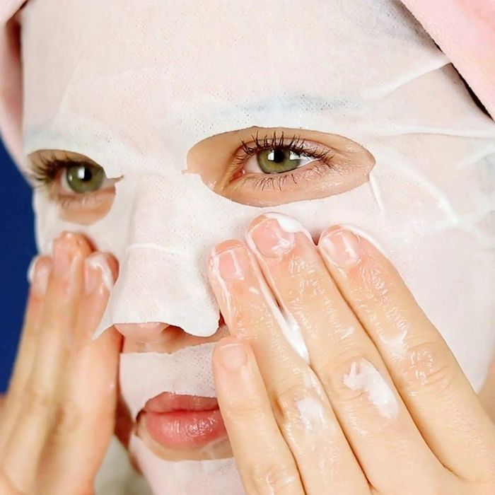 A model enjoying the benefits of one of the sheet masks.