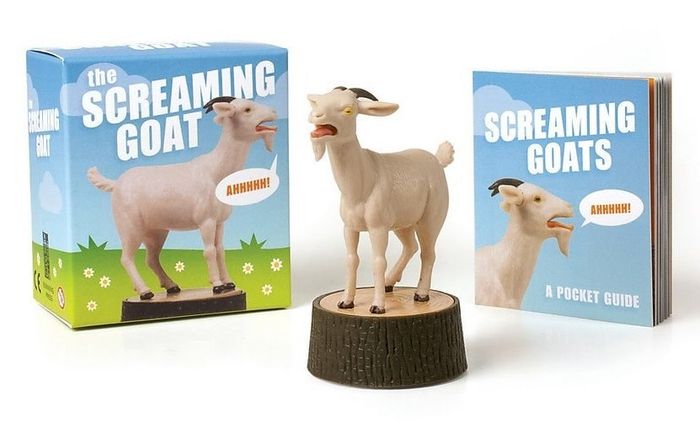 The goat figurine, along with its box and booklet.
