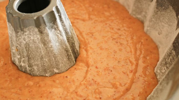 Cake batter placed in a bundt pan