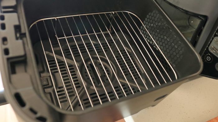 Inside the basket of an air fryer.