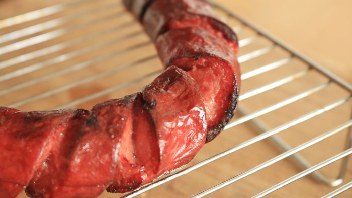 Close-up view of kielbasa with a spiral cut.