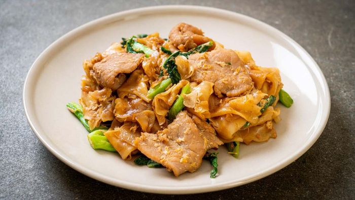 Pad See Ew, served on a plate.